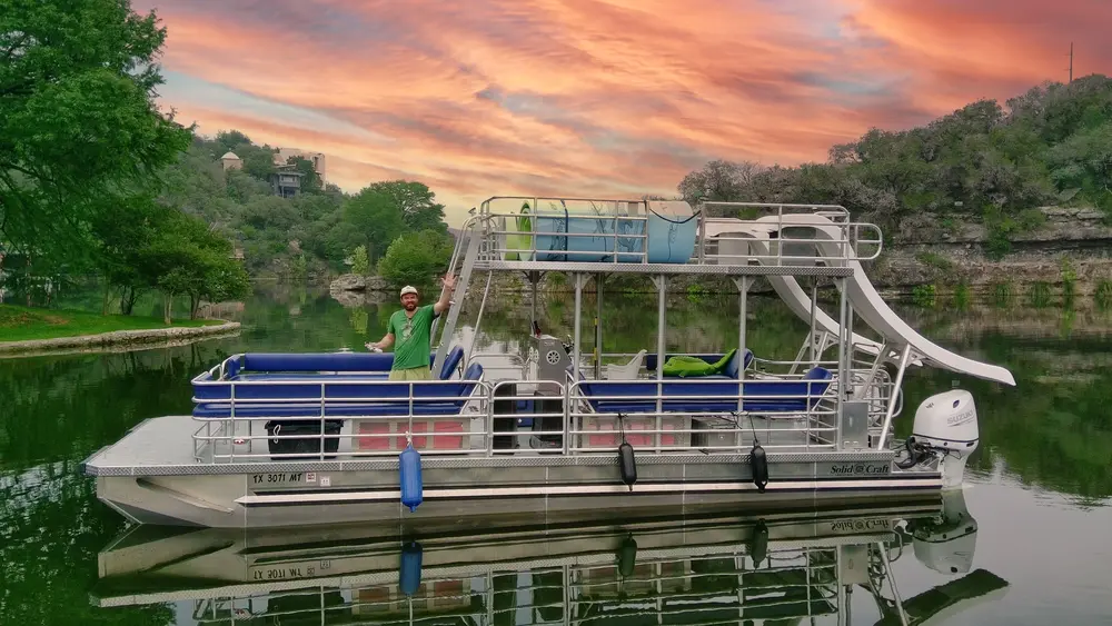 Longhorn Leisure double-decker boat with two slides on Lake Austin
